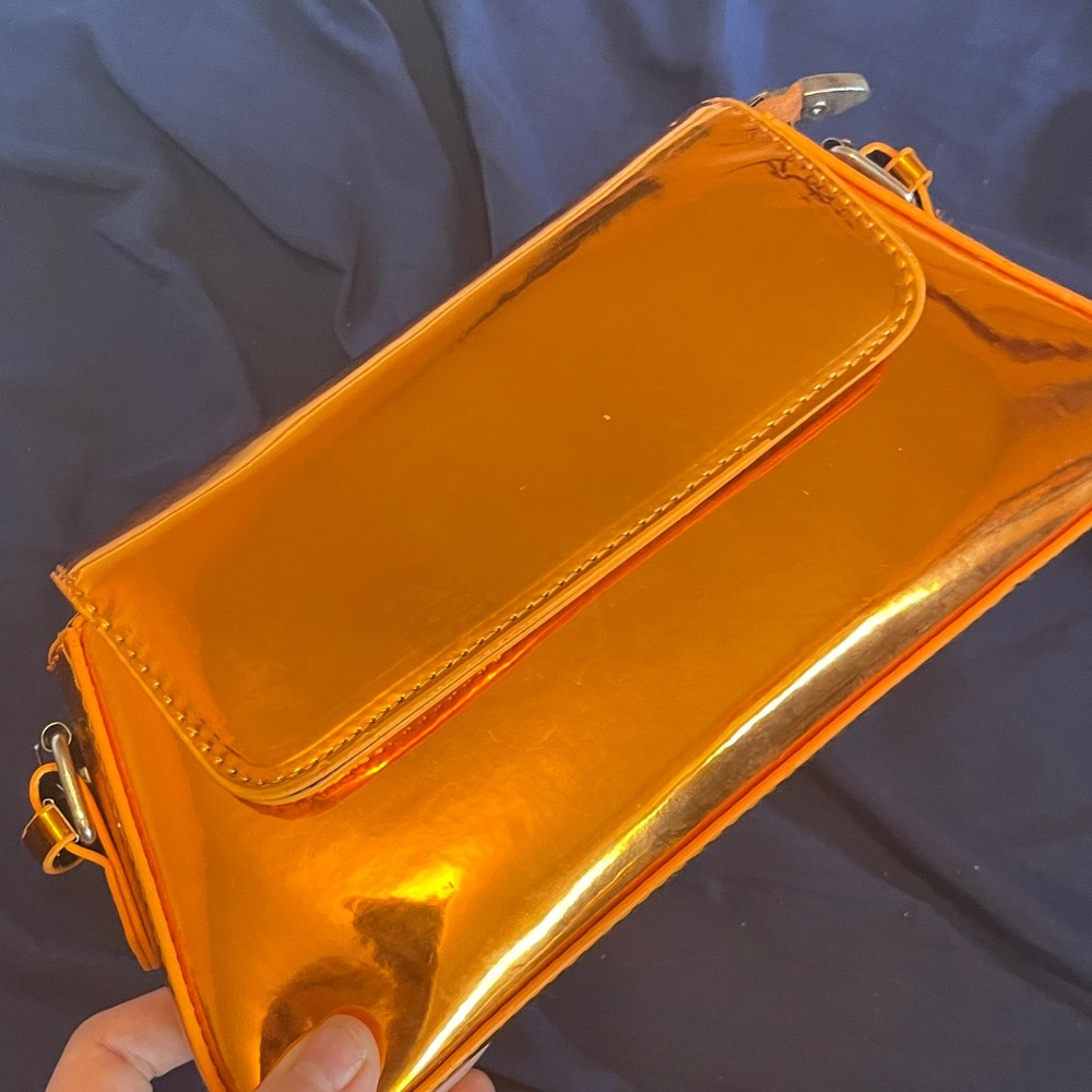 Shimmering Gold Clutch with Orange Accents